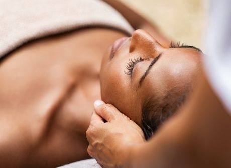 African American Female Receives Brightening Facial