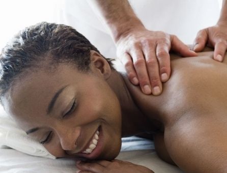 black female receiving massage therapy
